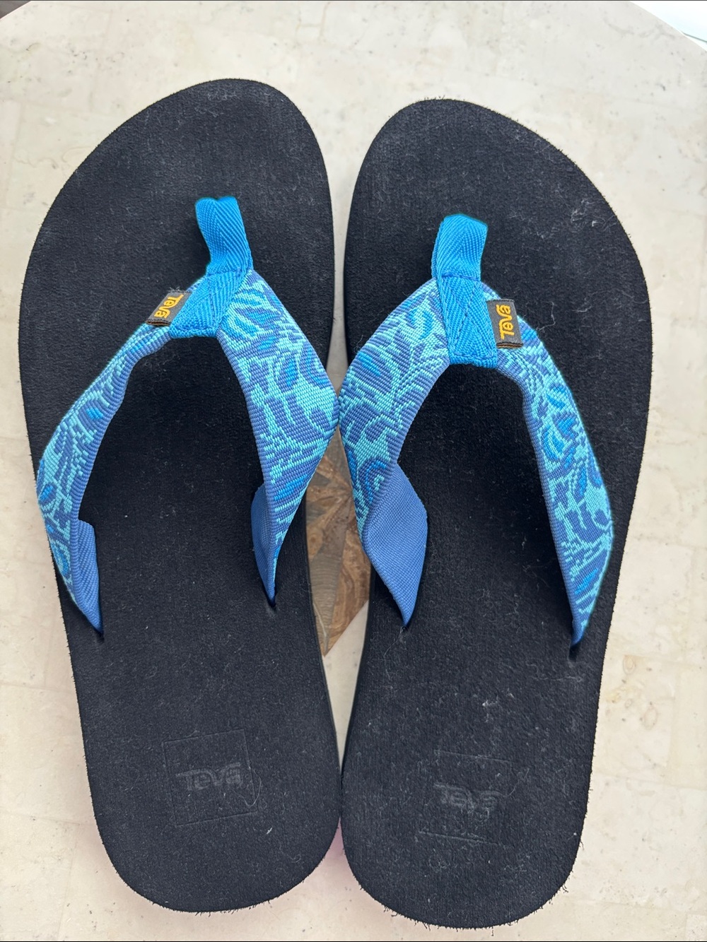 Teva Men’s Blue Patterned Strap Flip Flops with Black Footbed - size 12